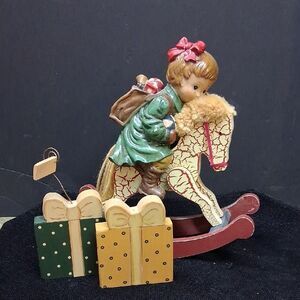 Hummel Style Little Girl On Rocking Horse with Her Presents
